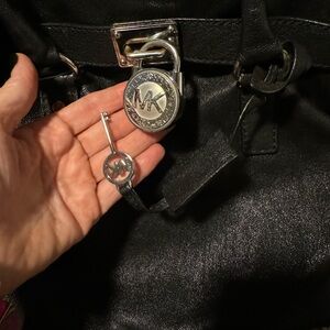 Beautiful black Michael Kors Large Hamilton bag with silver hardware.